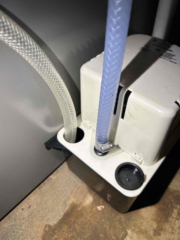 Responded to service call for malfunctioning condensate pump that was leaking and failing to properly evacuate water. Diagnosed issue as missing clamp on hoses causing air pressure loss, which prevented proper water extraction. Installed appropriate clamp and sealed connections, successfully eliminating the leak and restoring proper condensate flow.