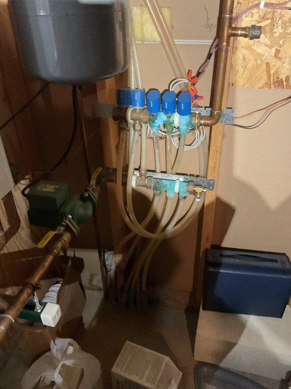 Responded to no heat call for a 23-year-old furnace. Diagnosed system throwing error codes due to faulty hot surface igniter, which was not glowing despite power reaching it (confirmed at 0 ohms). Observed proper operation of inducer motor and pressure switch. Also identified significant corrosion on the manifold for the in-floor radiant heat system, with visible blue-green oxidation on multiple copper fittings. After discussing options, homeowner declined repairs as system was previously identified as nearing end of life during October service visit.
