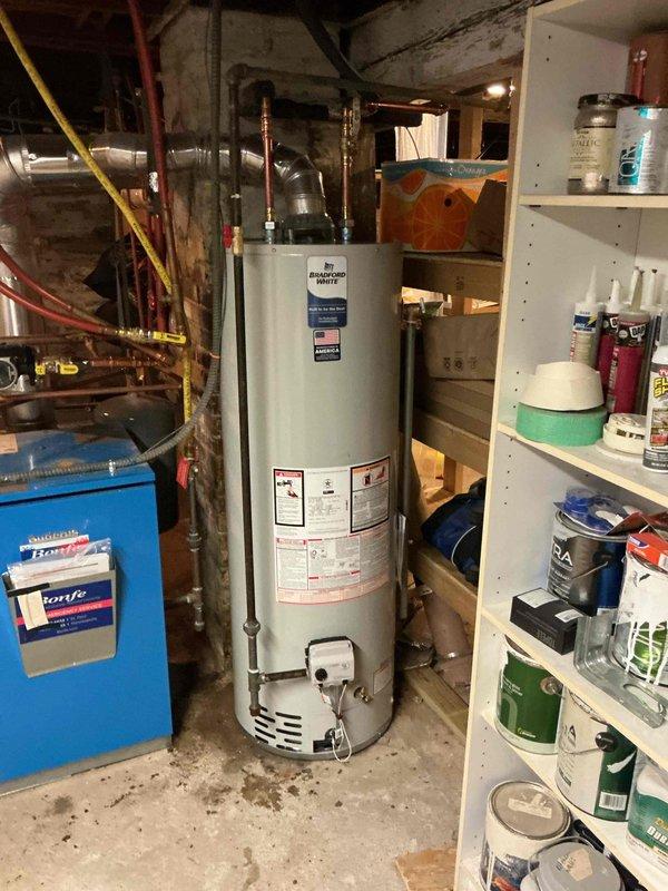 Responded to service call for 8-12 Rheem natural gas water heater failing to maintain flame. Customer had already consulted with Rheem technical support who suspected control module issue. Upon inspection, determined customer was pursuing warranty service through original installer and did not require our plumbing services.