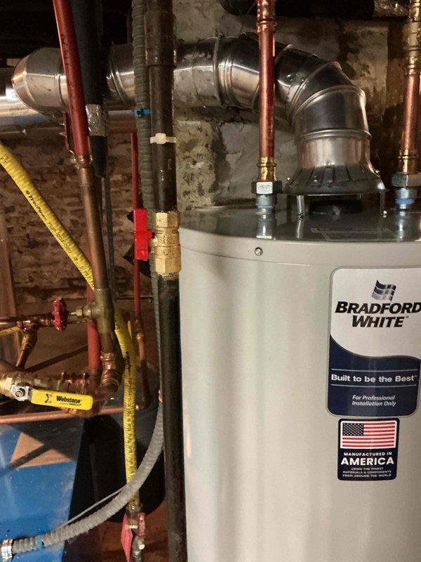 Responded to service call for 8-12 Rheem natural gas water heater failing to maintain flame. Customer had already consulted with Rheem technical support who suspected control module issue. Upon inspection, determined customer was pursuing warranty service through original installer and did not require our plumbing services.