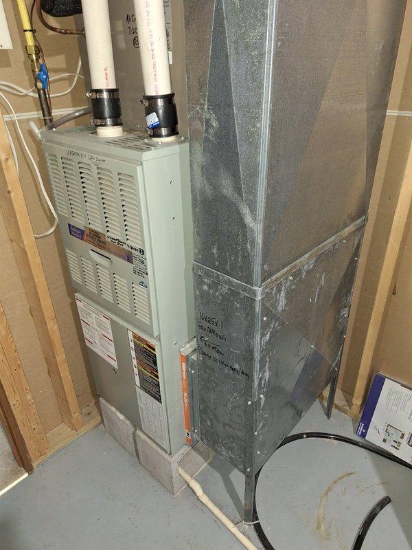 Diagnosed no heat complaint on 20+ year old forced air furnace where system would turn on but blower wasn't functioning. Found blower motor capacitor severely failed (measured 0.255 µF against 5 µF specification). Replaced capacitor which restored proper system operation. Noted potential heat exchanger issue requiring further evaluation; scheduled follow-up with service advisor due to age of equipment.
