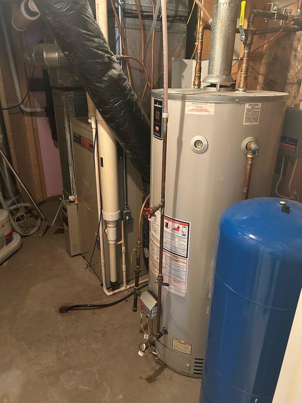 Diagnosed water heater showing no hot water with five-blink error code indicating thermostat fault. Performed maintenance on Bradford White unit by cleaning burner assembly and thermal couple. System operated temporarily before error code reappeared, suggesting potential thermostat or sensor issue requiring further attention.