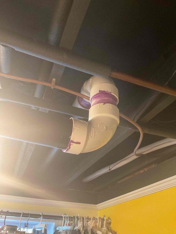 Responded to warranty service call regarding water leakage from recently installed exhaust system. Performed inspection of the exhaust piping in ceiling area, identifying improper drainage at elbow joint connections. Corrected issue by reinstalling affected PVC section with proper primer/cement application and ensuring appropriate pitch for condensate drainage.