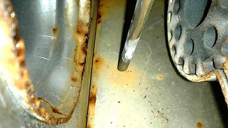 Responded to no heat call for furnace operating 12° below setpoint. Diagnostic testing revealed failed inducer motor with visible corrosion and rust formation on internal components. Successfully replaced inducer motor assembly, restoring proper system operation and heat production.