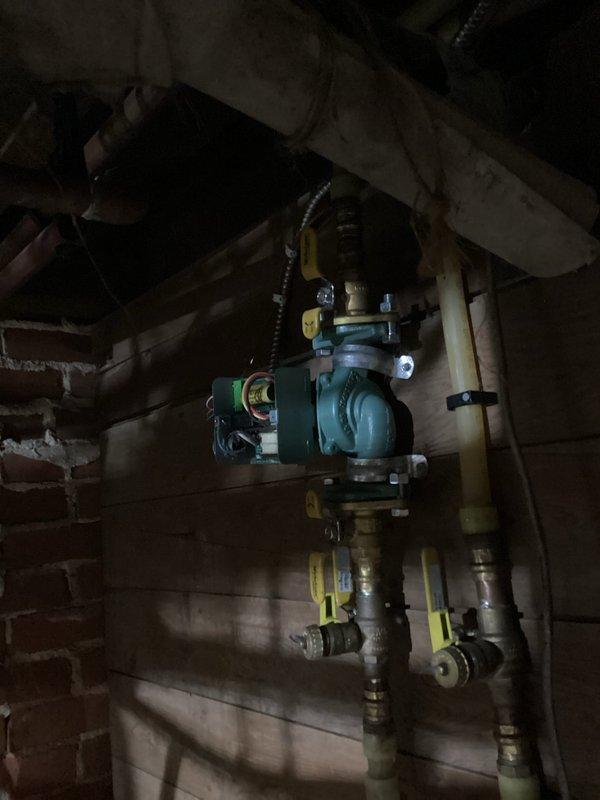 Inspected hot water boiler system (5-year-old unit) after customer reported one room not heating. Diagnosed faulty electronic circulation pump - verified power supply to unit but confirmed pump was not circulating water through the affected loop. Took detailed photos of the installation and pump assembly for documentation. Informed homeowner of findings and advised replacement of the circulation pump, which will require a follow-up service call for installation once part is ordered.