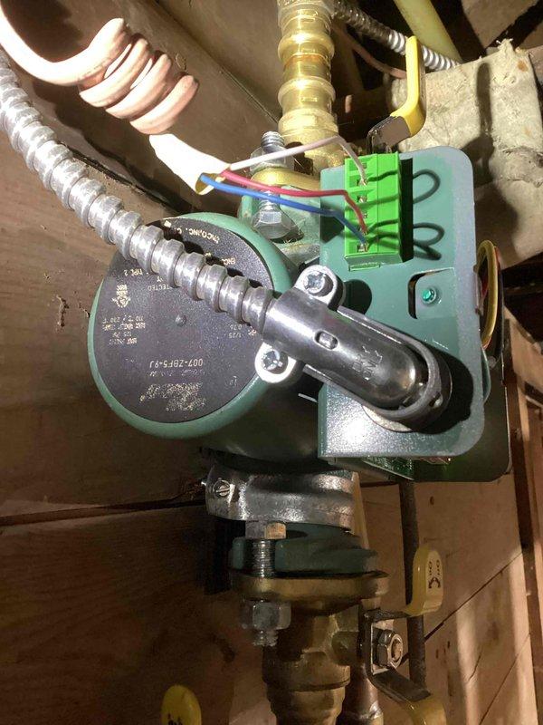 Inspected hot water boiler system (5-year-old unit) after customer reported one room not heating. Diagnosed faulty electronic circulation pump - verified power supply to unit but confirmed pump was not circulating water through the affected loop. Took detailed photos of the installation and pump assembly for documentation. Informed homeowner of findings and advised replacement of the circulation pump, which will require a follow-up service call for installation once part is ordered.