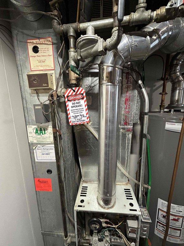 Responded to no heat service call for 15+ year old furnace exhibiting intermittent operation. Diagnostic inspection revealed two cracks in heat exchanger, presenting a significant safety hazard. Recommended complete heat exchanger replacement or full furnace replacement as appropriate remedial options given system age and condition.