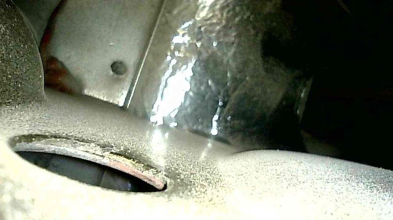 Responded to no heat call and found furnace with multiple issues including plugged condensate drain causing water backup in inducer, worn blower motor bearings with excessive play, and failing capacitor (7.5uf measuring 6.5uf). Critical safety concern identified - heat exchanger inspection revealed rotted secondary heat exchanger with detached rings. Due to safety hazards and equipment age, furnace was tagged out of service and customer advised to consider replacement rather than repair.