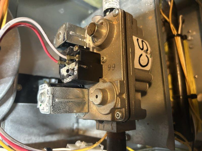 Diagnosed furnace with flashing service light indicating switch failure. Upon inspection, discovered failed gas valve as root cause of no heat condition. Removed defective valve, installed new replacement gas valve, and calibrated proper gas pressures. Verified system operation with temperature reading of 118.7°F. System is now heating properly and functioning as designed.