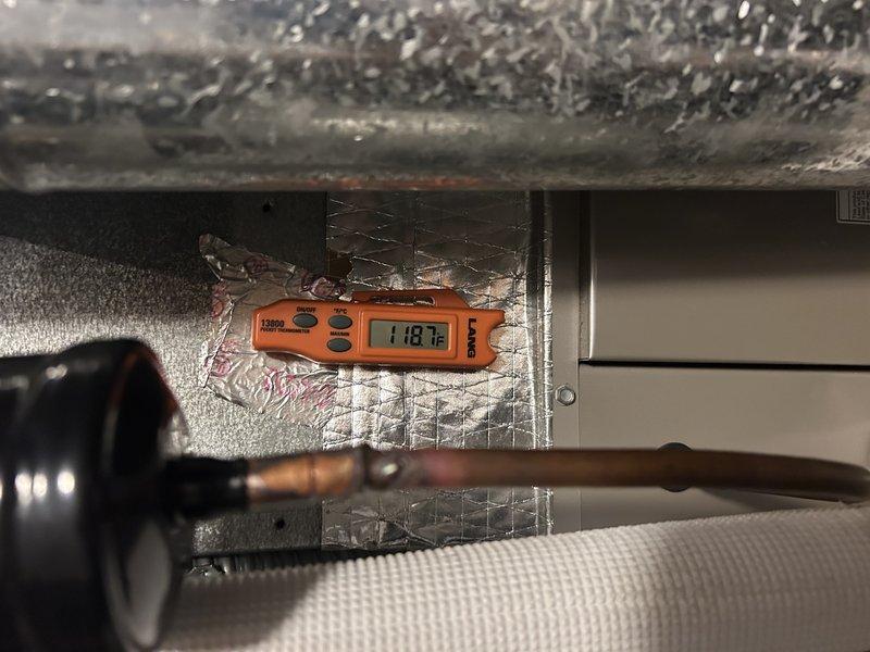 Diagnosed furnace with flashing service light indicating switch failure. Upon inspection, discovered failed gas valve as root cause of no heat condition. Removed defective valve, installed new replacement gas valve, and calibrated proper gas pressures. Verified system operation with temperature reading of 118.7°F. System is now heating properly and functioning as designed.