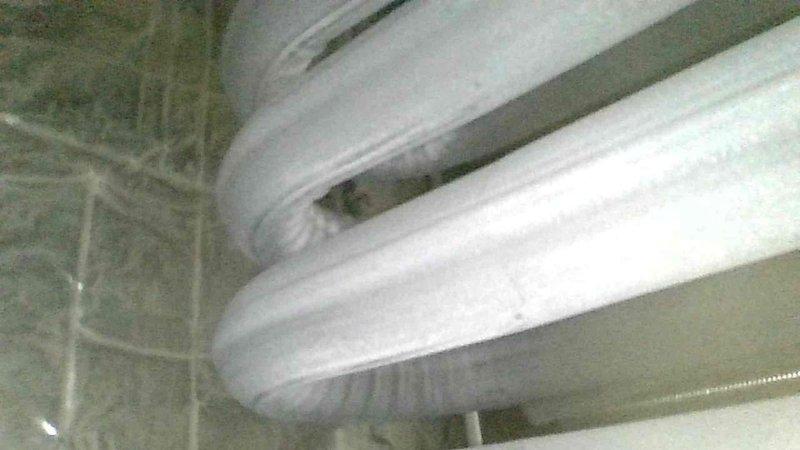 Responded to no heat complaint on older mobile home furnace. Diagnosed water accumulation in inducer motor due to plugged condensate line. Drained approximately 2 cups of water from collector box and cleaned trap to restore proper drainage. Noted significant bearing play and dirt accumulation in blower motor. After clearing condensate and cycling power, furnace operated normally for 20 minute test period. Heat exchanger inspection revealed no compromises. Customer advised to schedule evaluation for potential replacement options due to unit's age and condition.