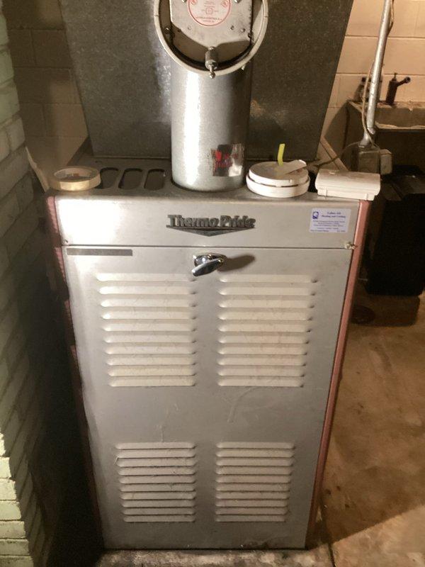Responded to no-heat call for 30+ year old ThermoElite oil furnace. Diagnosed ignition failure due to clogged nozzle. Replaced nozzle, bled fuel line, and reset control module, restoring proper system operation. Recommended module replacement for continued reliable performance.