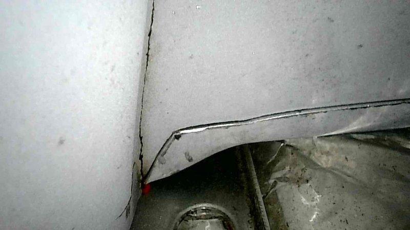 Responded to no heat complaint where furnace was short-cycling and struggling to maintain temperature. Diagnosed flame sensing issue and performed flame sensor cleaning. Further inspection revealed a cracked heat exchanger with debris on secondary heat exchanger and a compromised burner inlet. Also identified defective blower capacitor (reading 10μF instead of rated 12.5μF) and worn blower motor bearings. Tagged unit as unsafe due to heat exchanger failure and scheduled follow-up consultation for replacement options.