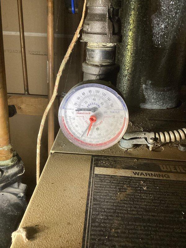 Responded to call for a 12-4 NG boiler system (10+ years old) not providing heat. Diagnosed low water pressure and stagnant circulation. Flushed system to remove significant discoloration and air pockets, restoring proper water flow and system operation. Identified leaking air eliminator as root cause; recommended replacement to prevent recurrence.
