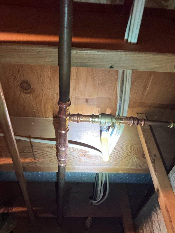 Responded to a service call for water leakage in a previously serviced area. Upon inspection of the copper pipe system in the basement/crawlspace, determined the press ball valve had not been fully pressed during prior installation. Corrected the issue by properly pressing the fitting to establish a secure connection, which resolved the leak.