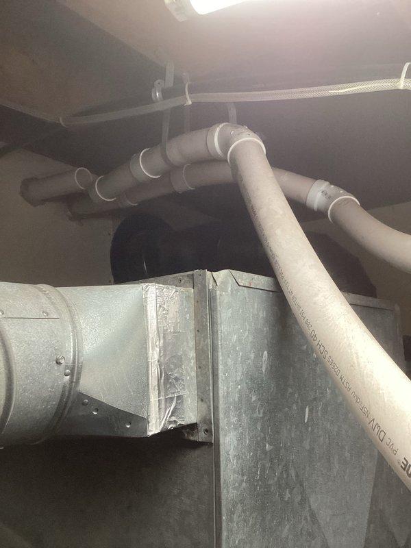 Responded to service call for 3-year-old Lennox furnace with failed PVC venting. Discovered PVC exhaust pipes had overheated and collapsed due to proximity to customer's woodstove. Documented damage with photos and completed temporary repairs. Submitted work order for installation team to relocate venting to safer location away from heat source, with proposed new location marked on exterior wall.