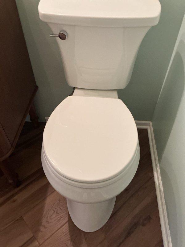 Responded to a callback regarding a toilet with an unlevel tank from previous installation. Issue verified using spirit level. Tank position adjusted and properly leveled to ensure correct operation and aesthetic appearance of the fixture.
