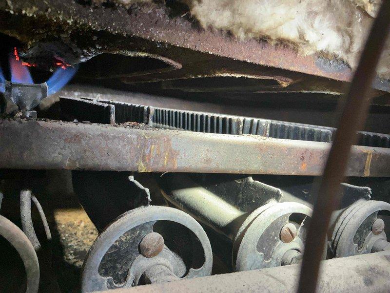 Responded to second opinion service call for a 1960 boiler with reported CO leak. Upon inspection, confirmed presence of carbon monoxide leaking from boiler jacket and high CO emissions through chimney. Visual examination revealed significant oxidation and deterioration of metal components with flame improperly burning in confined space, validating previous technician's safety concerns. Unit requires replacement due to age and safety hazards.