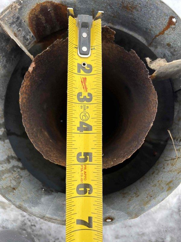 Diagnosed a 5-6 year old furnace with insufficient heating due to a weak flame code. Investigation revealed a completely rusted out roof jack on the exhaust and intake, causing the furnace to draw in exhaust fumes. Temporarily cleared ice buildup around intake, but determined the severely corroded component requires replacement to restore proper combustion and heating function.