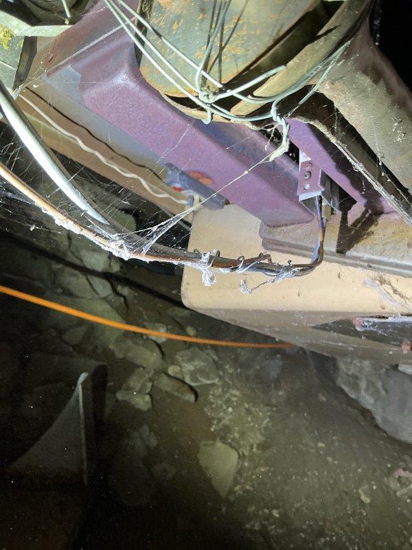 Responded to no heat call for 30-40 year old LP radiant furnace. Diagnosed multiple critical safety issues including unlit pilot light, corroded thermocouple, holes in the exhaust collector box, and improperly secured gas burner tube (wired on). Recommended full system replacement through comfort advisor due to age and extensive deterioration of critical components.