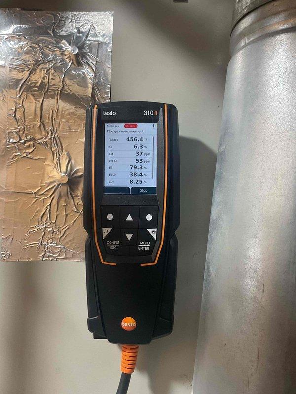 Responded to no heat call for furnace over 10 years old exhibiting intermittent operation. Diagnostic testing revealed dirty flame sensor causing system shutdown. Performed cleaning of flame sensor. Combustion analysis with Testo 310 confirmed proper operation with acceptable flue gas parameters (CO₂: 8.25%, efficiency: 79.3%). System now operating within normal parameters.