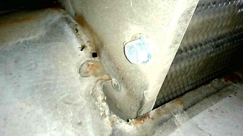 Inspected 21-year-old natural gas furnace reporting intermittent heat. Diagnosed weak flame code and cleaned dirty flame sensor. Further inspection revealed multiple perforations at the primary-to-secondary heat exchanger junction, which were visually confirmed with the homeowner. Due to compromised heat exchanger integrity, recommended complete system replacement and scheduled consultation for same-day quote.