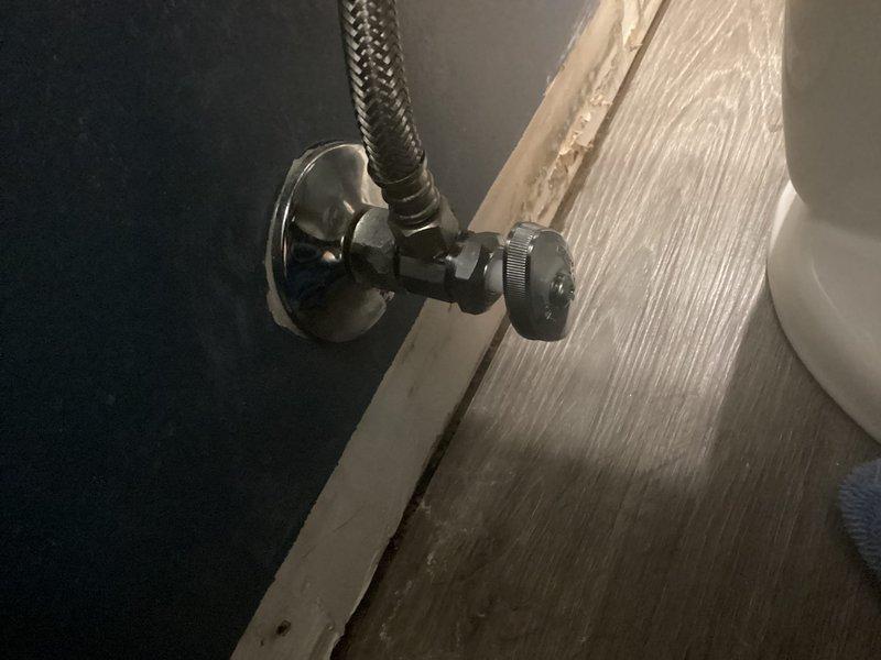 Responded to service call for water leaking from toilet onto floor. Diagnosed issue as faulty feral valve on angle stop. Replaced angle stop to resolve leak, restoring proper water supply functionality to toilet.