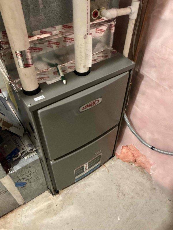 Responded to no heat complaint on 2-year-old Lennox furnace showing ignition lockout code. Diagnostic inspection revealed snow completely blocking roof exhaust pipe. Advised customer that a roofer is needed to properly clean and extend the exhaust vent to prevent future blockages and ensure safe system operation.