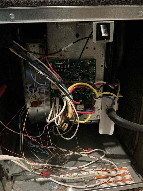 Performed standard maintenance inspection on 7-year-old American Standard furnace. Discovered cracked heat exchanger below burner inlet (crack less than 1 inch, not extending past factory crimp), weakened draft motor capacitor significantly below rating, and early signs of draft motor failure (faint grinding noise). Customer advised of findings and operational risks; no safety shutdown required. Complete system options reviewed with homeowner.