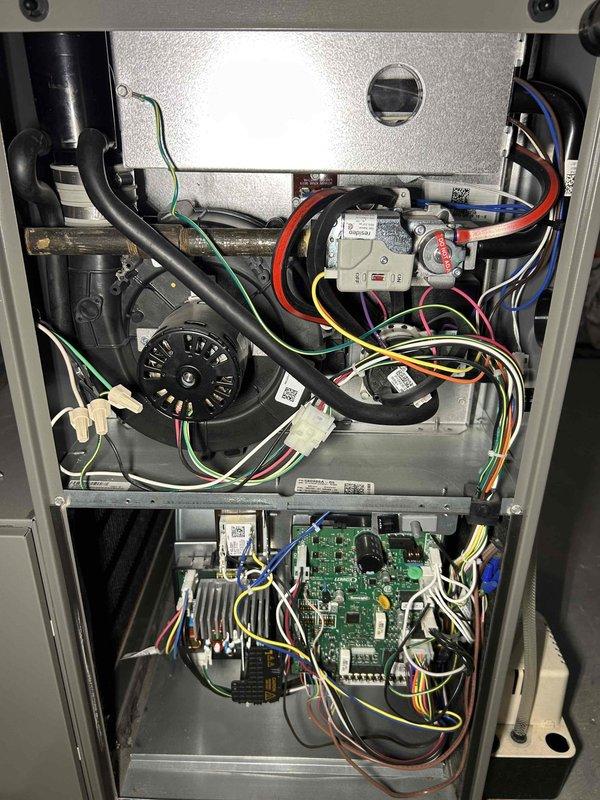 Performed annual furnace tune-up on 1-year-old FRP unit. Cleared condensate drain line and trap of accumulated debris and spiderwebs, verified proper operation of all critical components including inducer motor, capacitor, pressure switch, and control board connections. Combustion analysis showed CO at acceptable 13 ppm level, system operating within normal parameters with no immediate concerns.