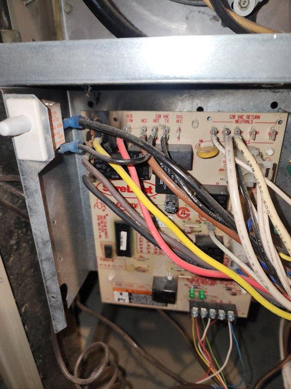 Responded to no-heat call for 23-year-old Lennox LP furnace exhibiting limit switch error. Diagnosed failed control board with burnt Case 3 relay preventing blower operation. Performed temporary repair by bypassing control board to allow continuous blower operation and restore heat. Provided recommendations for replacement of control board, collector box, burners, and capacitor.