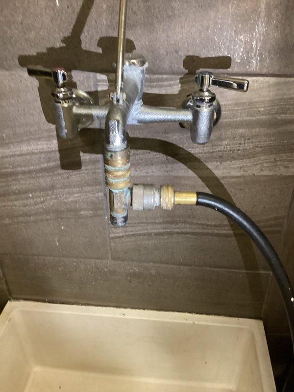 Inspected property regarding non-compliance issues cited by city inspector, specifically concerning a water tea installation for soap dispenser functionality and AVB compliance. Took photographic documentation of the copper piping installation and plumbing fixtures, then communicated directly with the inspector by sharing these images. Inspector confirmed the installation now meets code requirements and will return in approximately 20 days for final verification.