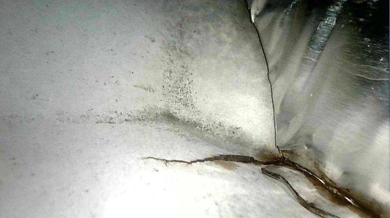 Diagnosed 10-year-old furnace with no heat issue. Found cracked heat exchanger documented in photos and failing inducer motor. Flame sensor was dirty, contributing to system malfunction. Replaced aging components to restore proper heating functionality.