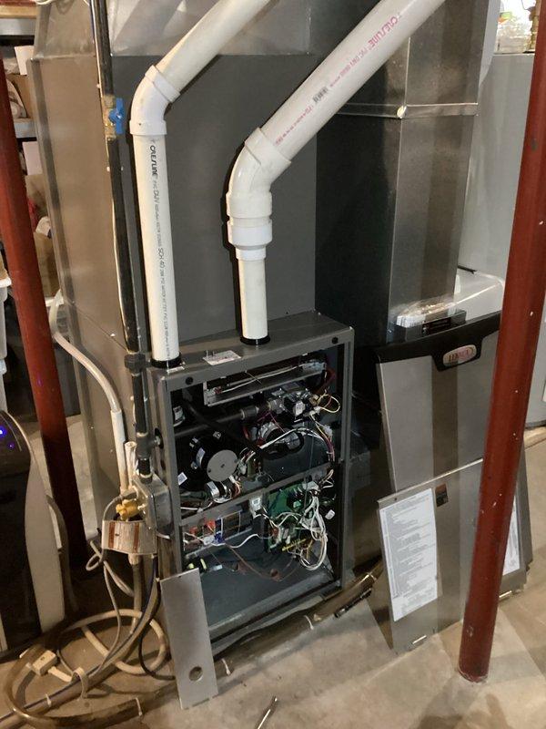 Responded to no-heat complaint for Lennox furnace. Diagnostic revealed water accumulation in inducer motor due to clogged exhaust drain pipe. Cleared blockage, flushed drainage system, and restored proper furnace operation. System functioning normally upon completion with all components verified.