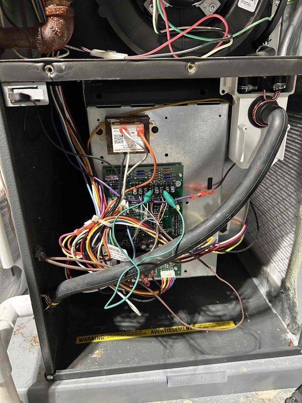 Performed comprehensive furnace tune-up on FRP system of unknown age. Cleared condensate drain line and trap of accumulated debris and spiderwebs, recorded combustion CO at 9 ppm, and verified proper operation of all critical components (inducer motor, capacitor, pressure switch, control board connections, and thermostat). System is functioning normally with no immediate concerns; return air filter in moderate condition.
