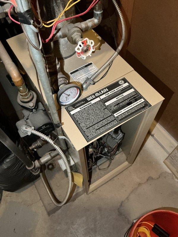 Responded to no-heat service call for 20+ year old Weil-McLain natural gas boiler. Diagnostic testing revealed failed thermostat, relay, and transformer components. Successfully replaced all defective parts and installed new boiler to restore heating function to the residence.