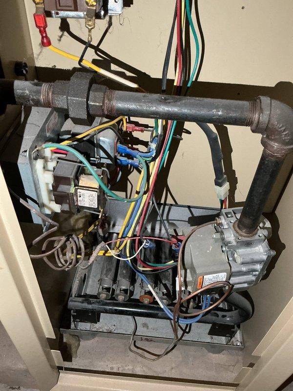 Responded to no-heat service call for 20+ year old Weil-McLain natural gas boiler. Diagnostic testing revealed failed thermostat, relay, and transformer components. Successfully replaced all defective parts and installed new boiler to restore heating function to the residence.