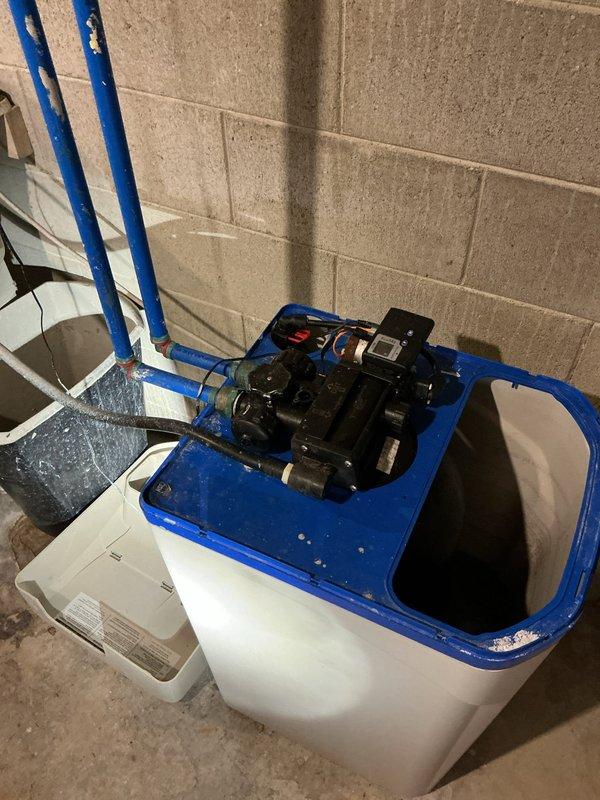 Responded to service call regarding hard water concerns. Inspected existing water softener system which appears functional but potentially using excessive salt. Noted significant corrosion at water heater tank inlet connection. Scheduled service advisor to provide customer with appropriate treatment options and pricing.