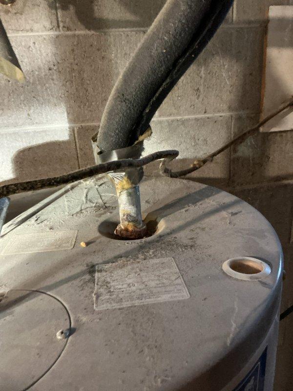 Responded to service call regarding hard water concerns. Inspected existing water softener system which appears functional but potentially using excessive salt. Noted significant corrosion at water heater tank inlet connection. Scheduled service advisor to provide customer with appropriate treatment options and pricing.