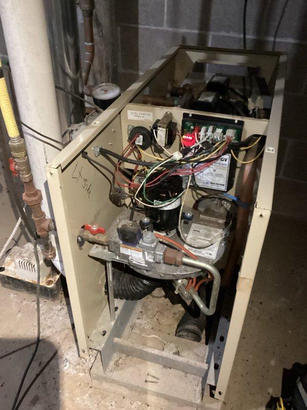 Performed boiler tune-up maintenance. Inspected heat exchanger, noting early rust accumulation that could potentially affect operation if it progresses. Vacuumed accessible bottom portion of unit. Confirmed proper igniter ohm readings and verified all radiators were functioning correctly with system pressure at approximately 12 psi. No water addition required at this time.