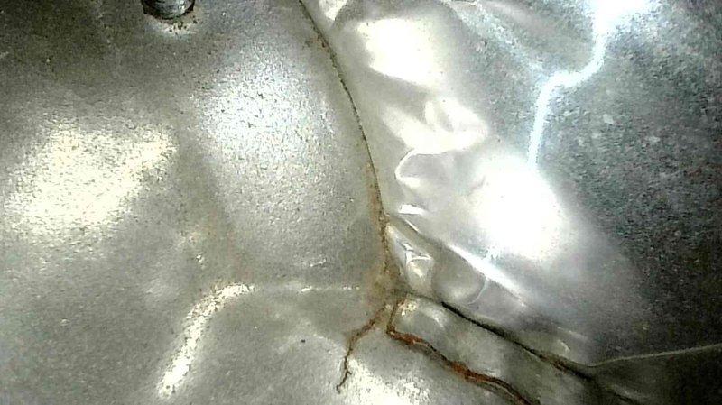 Performed diagnostic inspection on non-operational Trane furnace (2005). Identified two critical issues: gas valve was stuck closed/faulty and confirmed heat exchanger has developed a crack (visible corrosion along seam). Informed homeowner that unit requires either complete furnace replacement or heat exchanger replacement to restore proper operation and ensure safety.