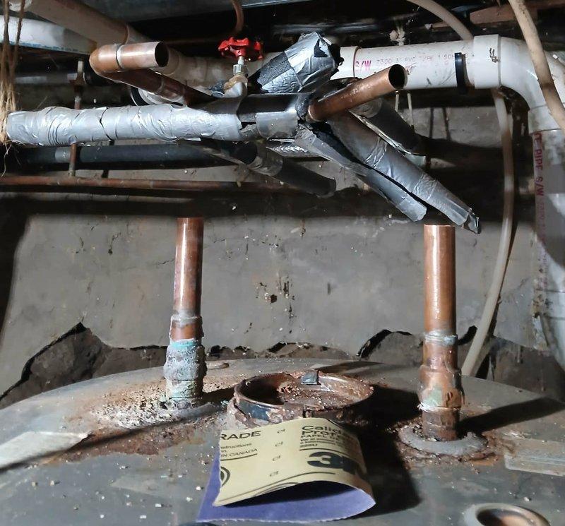 Responded to no hot water complaint at customer residence. Upon inspection, found water heater with corroded copper piping and faulty gas valve previously identified in November service call. Completed installation of new electric water heater with proper electrical connections, replacing the deteriorated tank system.