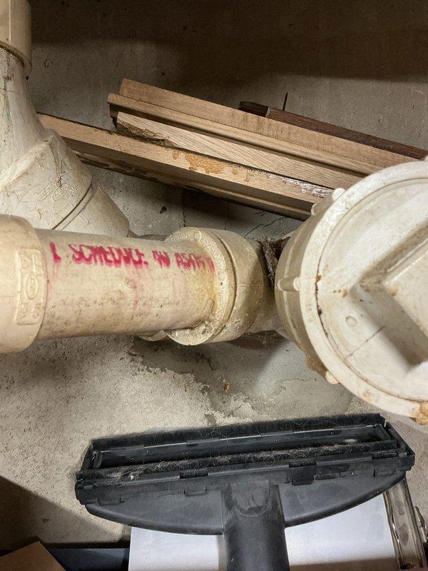 Responded to septic system service call where customer reported sewage odors and drainage issues from toilet basin. Upon inspection, identified problems with the vent piping system and septic pump operation. Documented existing PVC drainage configuration and mechanical room layout to prepare comprehensive estimate for necessary drain line and vent line re-piping work.