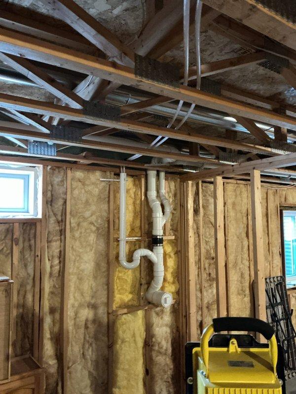 Installed new sewage ejector pump with high water alarm system to alert homeowner of potential backups or flooding in the septic system. Additional work included installation of black RO faucet and re-piping the drain from new water treatment system to standpipe, completing comprehensive plumbing system upgrades in basement mechanical area. Total service time: 3-4 hours.