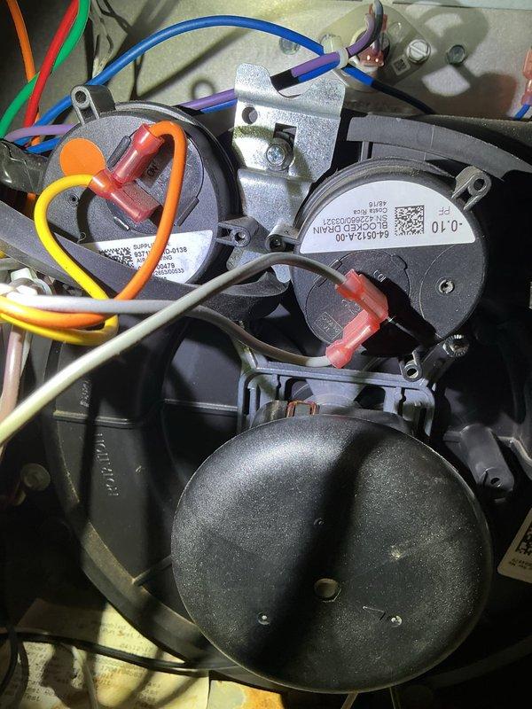 Diagnosed 8-year-old Amana furnace with no heat issue. Inspection revealed a pressure switch stuck in open position. Attempted to free the switch without success, requiring complete replacement of the pressure switch to restore proper furnace operation.