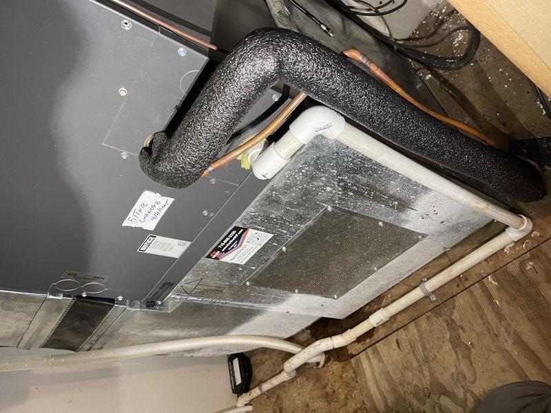Responded to service call for 2-year-old heat pump not heating properly. Diagnosed multiple issues including continuous air handler operation triggered by steam humidifier calls, condensate drain leakage near garage air handler requiring replacement fittings, and client confusion regarding thermostat operation in this complex system. Return visit scheduled to complete annual maintenance service on boiler, air handler, and steam humidifier, and to install new humidifier canister and repair condensate drainage system.