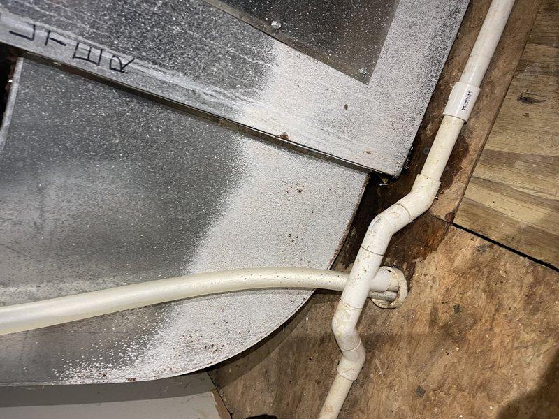 Responded to service call for 2-year-old heat pump not heating properly. Diagnosed multiple issues including continuous air handler operation triggered by steam humidifier calls, condensate drain leakage near garage air handler requiring replacement fittings, and client confusion regarding thermostat operation in this complex system. Return visit scheduled to complete annual maintenance service on boiler, air handler, and steam humidifier, and to install new humidifier canister and repair condensate drainage system.