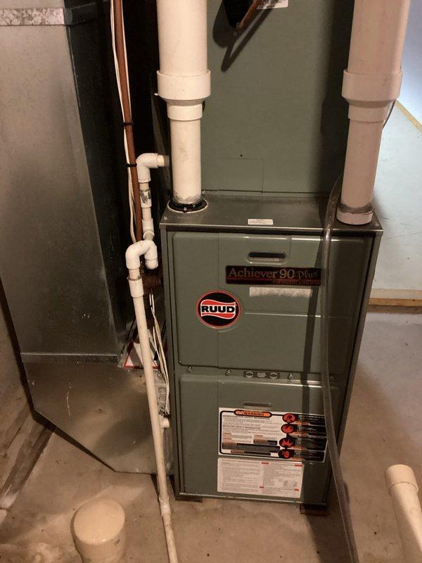 Responded to no-heat call on 20+ year-old Ruud Achiever 90 Plus LP furnace with intermittent ignition failure. Inspection revealed furnace was operating but displaying ignition failure code. Discovered corroded spark igniter and performed maintenance including cleaning igniter, flame sensor, and confirming proper air filter condition. System was tested and functioning properly upon completion, though customer advised to monitor performance.