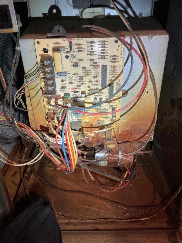 Responded to no-heat call for 19-year-old Carrier furnace. Diagnostic testing revealed seized induced draft motor and extensive water damage from AC affecting multiple components including control board, burners, and blower motor. Replaced induced draft motor to restore immediate heating function and scheduled service advisor for assessment of additional damaged components. Verified proper operation before departure.