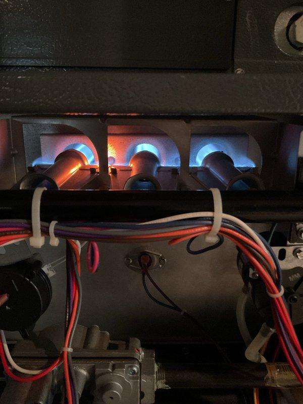 Responded to no-heat call where customer reported intermittent operation. Determined cause was BBQ grill placed against exhaust and intake terminations by deck contractors. System resumed normal operation after obstruction was removed. Performed visual inspection of combustion process and terminations; verified proper flame characteristics and venting configuration. All components functioning correctly.